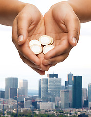 Image showing womans cupped hands showing euro coins