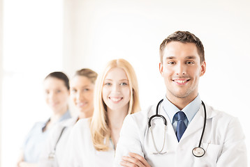 Image showing male doctor in front of medical group