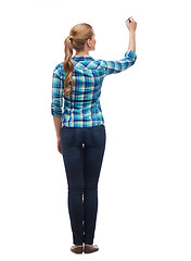 Image showing woman from the back writing something in the air