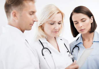 Image showing doctors looking at tablet pc