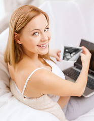 Image showing smiling pregnant woman with laptop computer