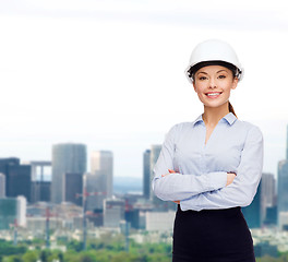 Image showing friendly smiling businesswoman in white helmet