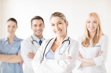 Image showing female doctor in front of medical group