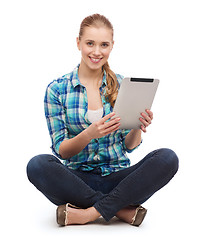 Image showing young woman in casual clothes sitting on floor