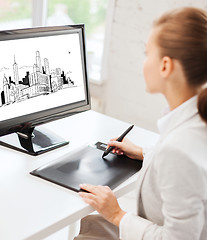 Image showing architect with drawing tablet in office