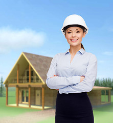 Image showing friendly smiling businesswoman in white helmet