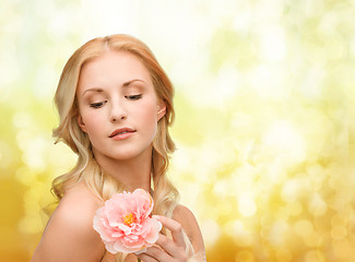 Image showing lovely woman with peony flower