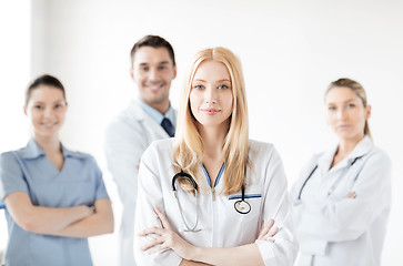 Image showing female doctor in front of medical group