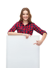 Image showing smiling young teenage girl with white blank board