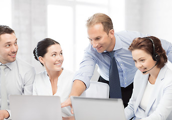 Image showing group of people working in call center