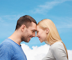 Image showing smiling couple looking at each other