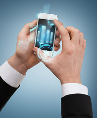 Image showing businessman touching screen of smartphone