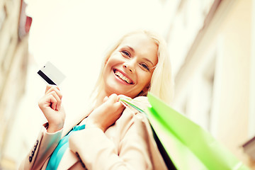 Image showing woman with shopping bags in city