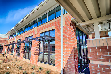 Image showing brick building architecture with suncreen shades on windows