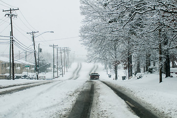 Image showing snow covered road and trees after winter storm