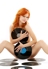 Image showing naked redhead with vinyl records