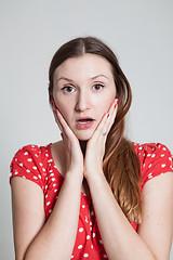 Image showing Surprised looking attractive woman