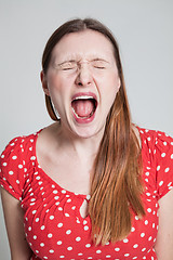 Image showing Stressed attractive woman shouting