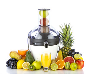 Image showing Fresh fruits and glass with juice near white juicer