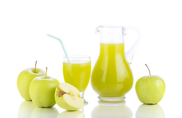 Image showing Fresh apples, glass with juice and carafe