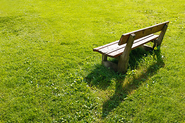 Image showing Lonely bench in backyard.