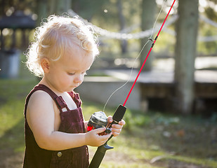 Image showing Cute Young Boy With Fishing Pole at The Lake