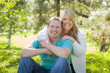 Image showing Young Attractive Couple Hugging in the Park