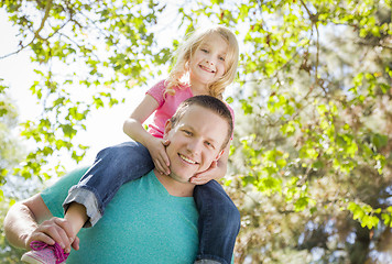 Image showing Cute Young Girl Rides Piggyback On Her Dads Shoulders