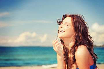 Image showing laughing woman on the beach