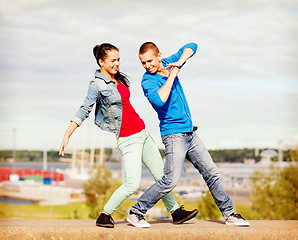 Image showing couple of teenagers dancing outside