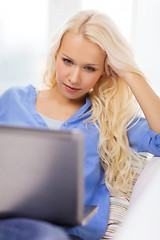 Image showing woman with laptop computer at home