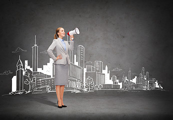 Image showing smiling businesswoman with megaphone