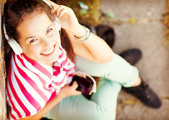 Image showing girl with headphones listening to music