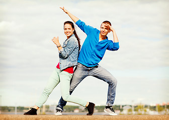 Image showing couple of teenagers dancing outside