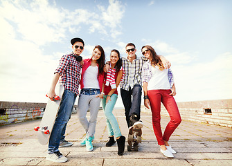 Image showing teenagers with skates outside