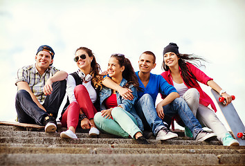 Image showing teenagers with skates outside