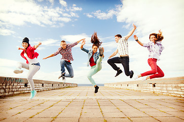 Image showing group of teenagers jumping