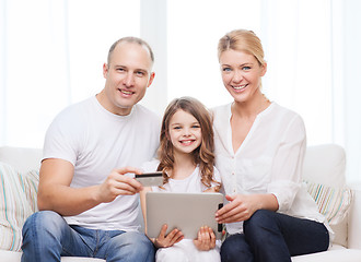 Image showing parents and girl with tablet pc and credit card