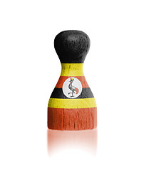 Image showing Wooden pawn with a painting of a flag