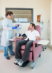 Image showing Nurse Examining Patient's Pulse Rate In Chemo Room