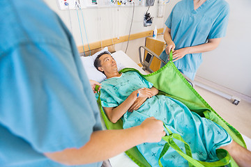 Image showing Nurses Preparing Mature Patient Before Transferring Him On Hydra