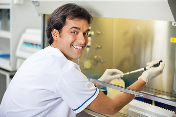 Image showing Male Technician Experimenting In Laboratory