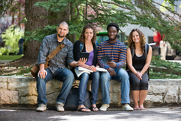 Image showing Portrait Of University Students Sitting On Campus