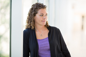 Image showing Thoughtful Female Student At University Corridor