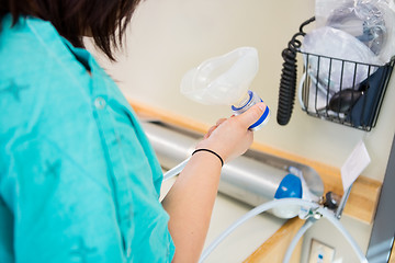 Image showing Pregnant Woman Holding Nitrous Oxide Mask