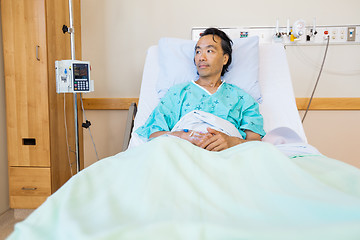 Image showing Patient Reclining On Bed While Looking Away In Hospital