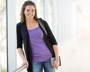 Image showing Happy Female Student With Digital Tablet And Backpack