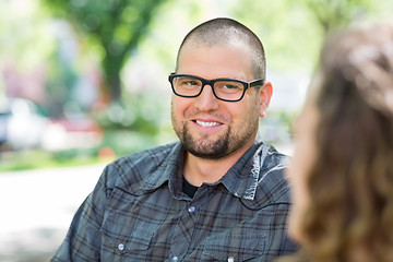 Image showing Smiling University Student Looking At Friend