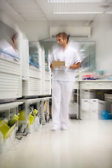 Image showing Technician Walking In Storage Room
