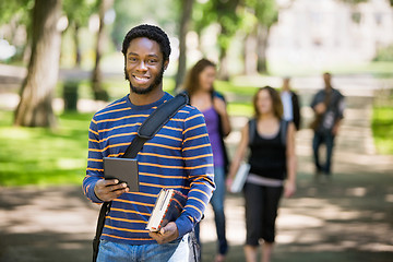 Image showing Happy Student Holding Digital Tablet On Campus